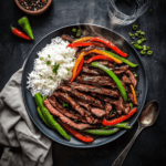 Pepper Steak stir-fry with flank steak strips and sliced bell peppers
